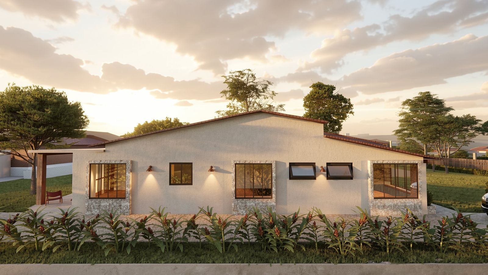 Fachada lateral ao entardecer com janelas emolduradas em pedra